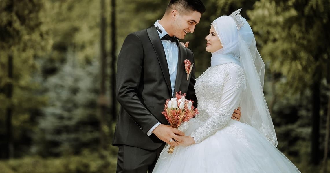 A bride and groom standing together on their wedding day