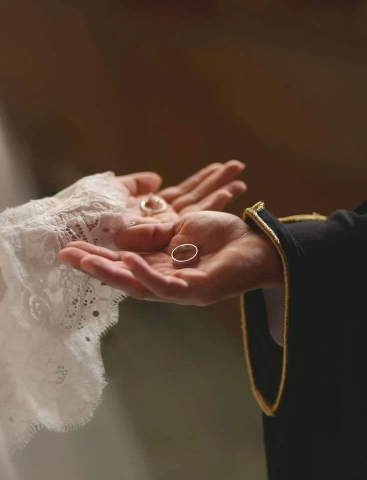 Couple holding hands on their wedding day